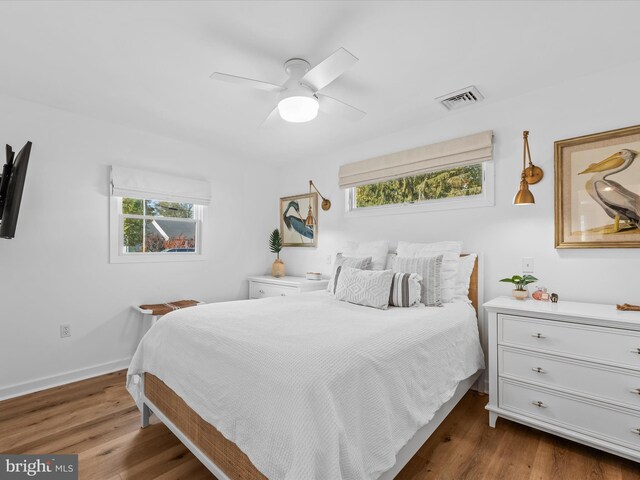 bedroom featuring dark hardwood / wood-style floors and ceiling fan