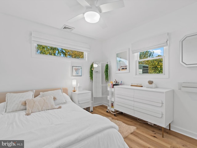 bedroom featuring wood-type flooring and ceiling fan