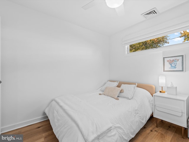 bedroom featuring hardwood / wood-style floors and ceiling fan