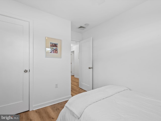 bedroom featuring hardwood / wood-style floors