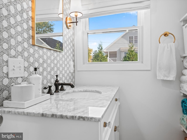 bathroom with vanity and plenty of natural light