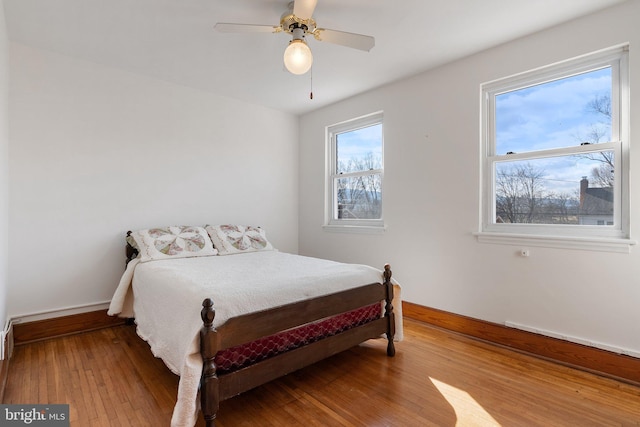 bedroom featuring ceiling fan and wood-type flooring