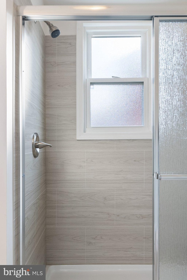 bathroom featuring an enclosed shower