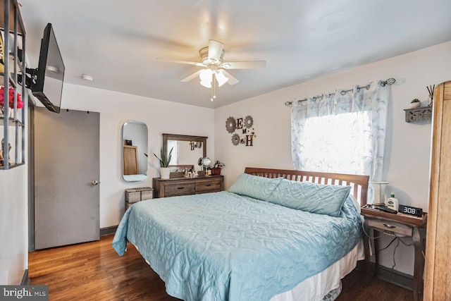 bedroom featuring ceiling fan and dark hardwood / wood-style flooring