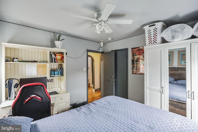 bedroom with hardwood / wood-style flooring and ceiling fan