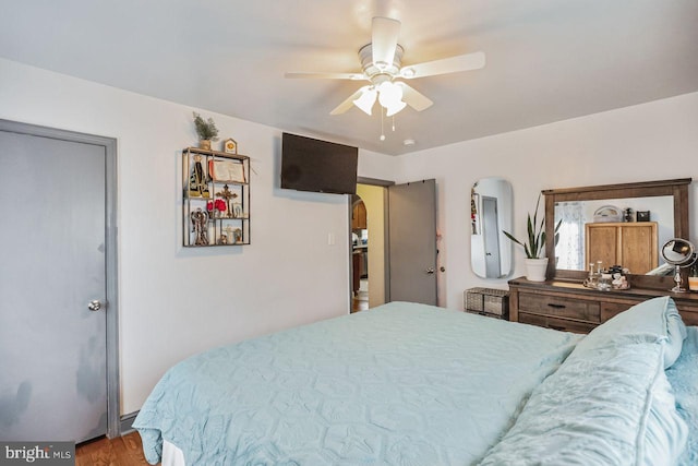 bedroom featuring hardwood / wood-style floors and ceiling fan