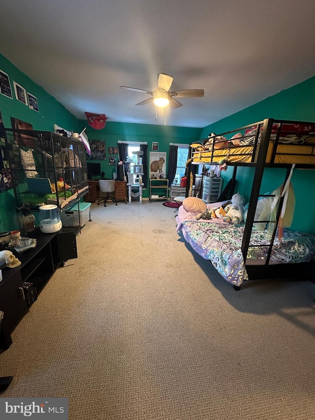 carpeted bedroom with ceiling fan