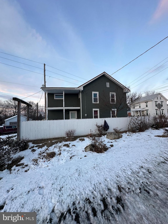 view of snow covered house