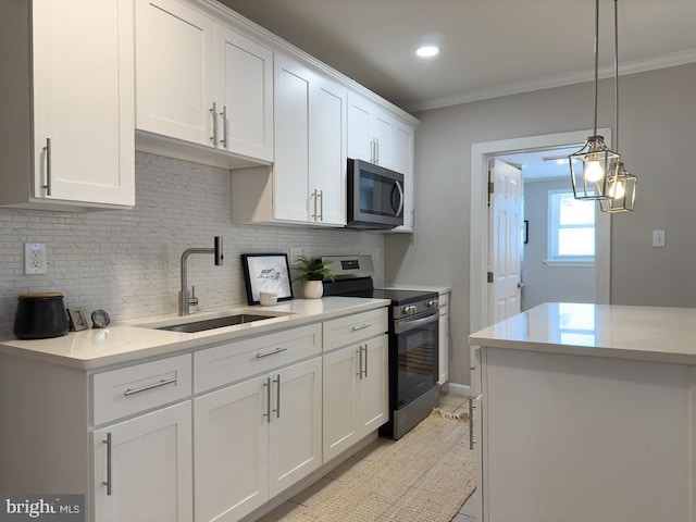 kitchen with decorative light fixtures, sink, white cabinets, light tile patterned floors, and stainless steel appliances