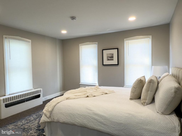 bedroom featuring radiator heating unit