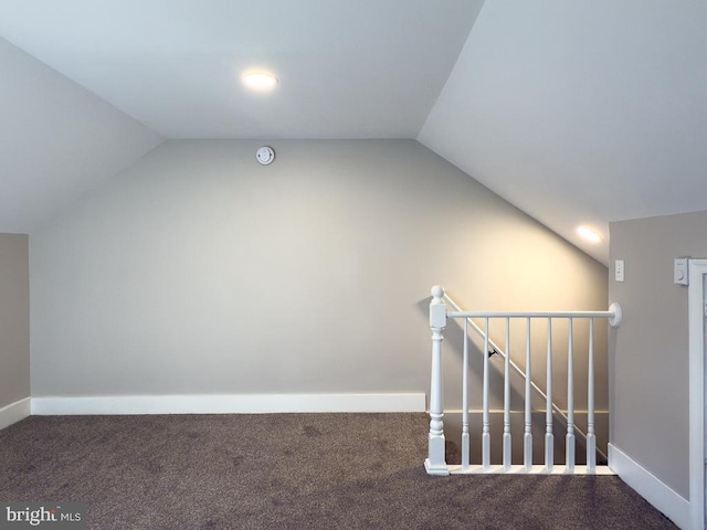 bonus room featuring lofted ceiling and carpet