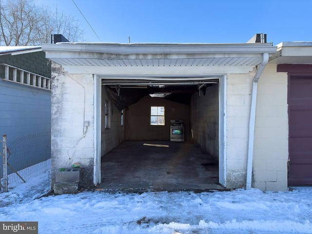 view of snow covered garage