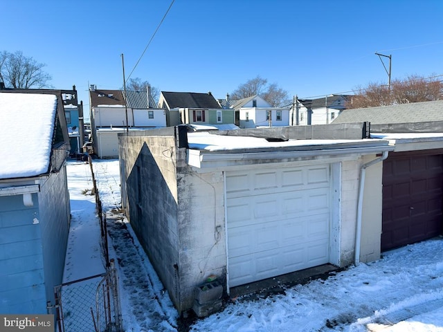 view of snow covered garage