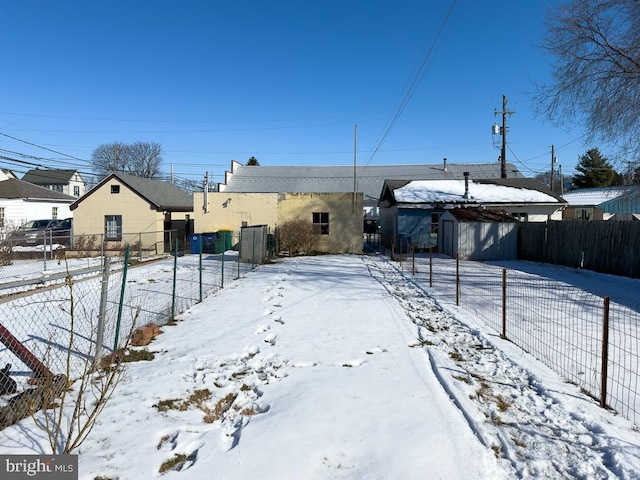 view of yard layered in snow