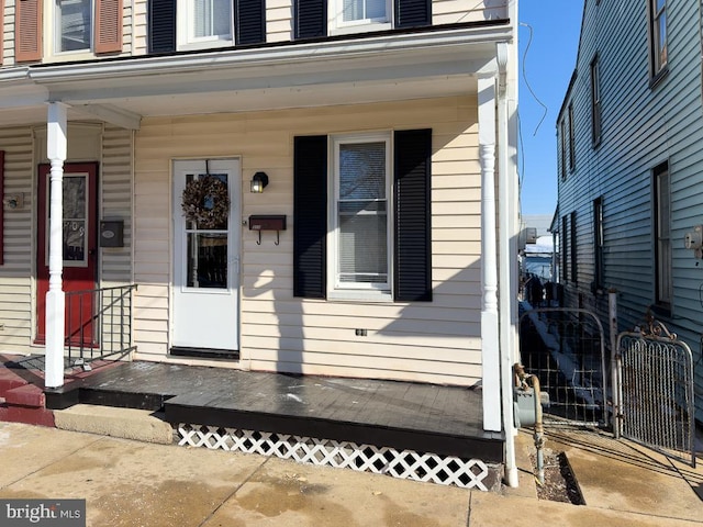 entrance to property with a porch