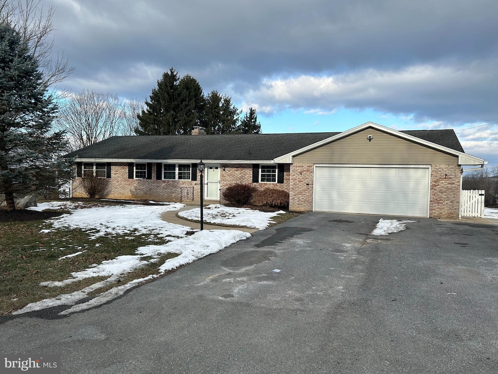 single story home with a garage