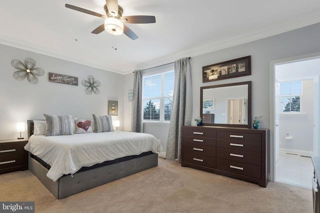 bedroom featuring crown molding, light carpet, and ceiling fan