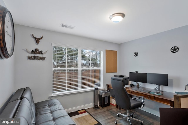 home office with hardwood / wood-style flooring