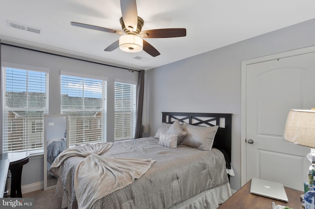 bedroom featuring ceiling fan and carpet