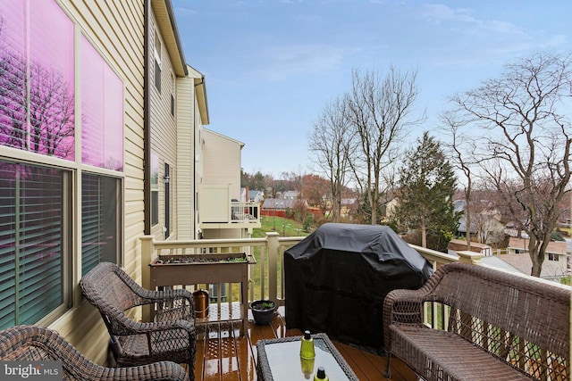 wooden deck featuring grilling area