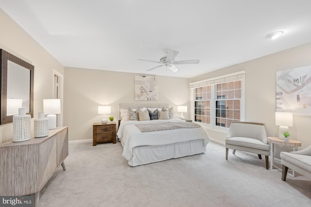 bedroom with ceiling fan and light colored carpet