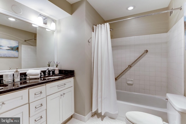 full bathroom with tile patterned flooring, vanity, shower / tub combo with curtain, and toilet