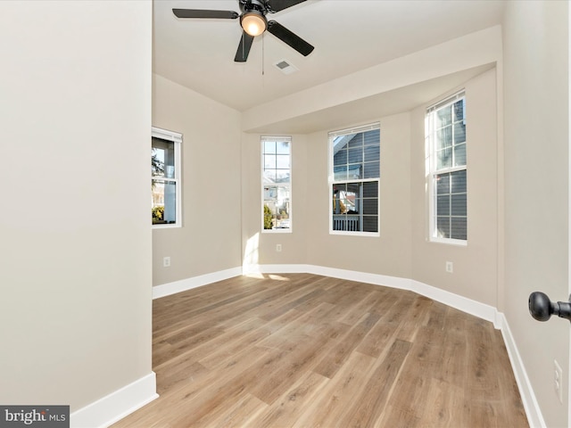 unfurnished room featuring ceiling fan and light hardwood / wood-style floors