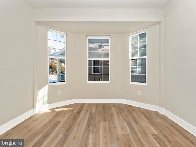 spare room featuring light hardwood / wood-style flooring