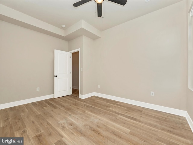 spare room with light hardwood / wood-style floors and ceiling fan