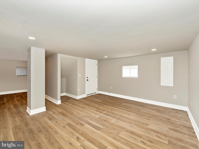 basement featuring light hardwood / wood-style flooring