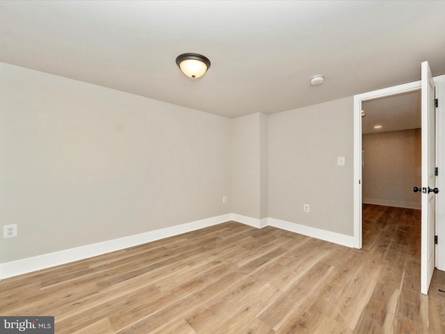 empty room with light hardwood / wood-style floors