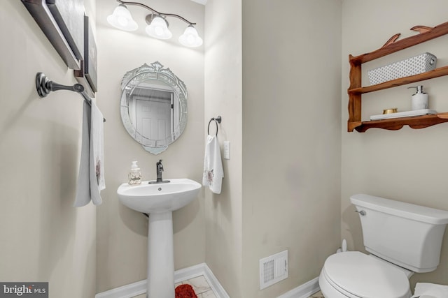 bathroom featuring sink and toilet