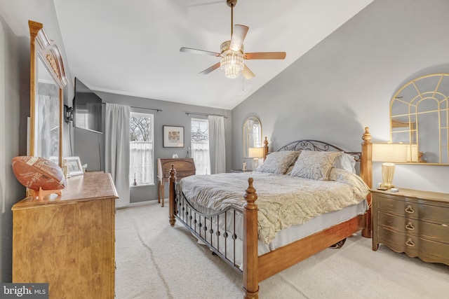 carpeted bedroom with vaulted ceiling and ceiling fan