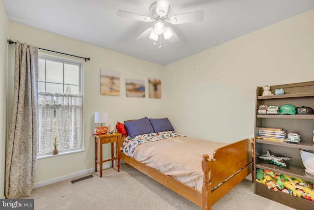 carpeted bedroom with ceiling fan