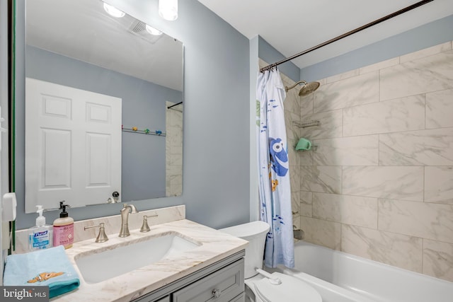 full bathroom with vanity, toilet, and shower / bath combo with shower curtain