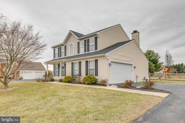 view of front of home featuring a garage, a porch, and a front lawn