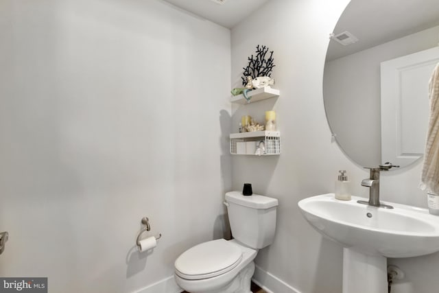 bathroom featuring sink and toilet