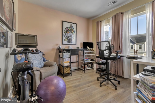 office with light wood-type flooring