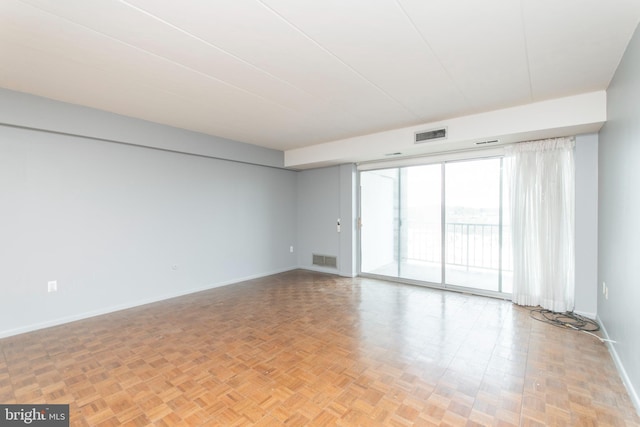 empty room with light parquet floors