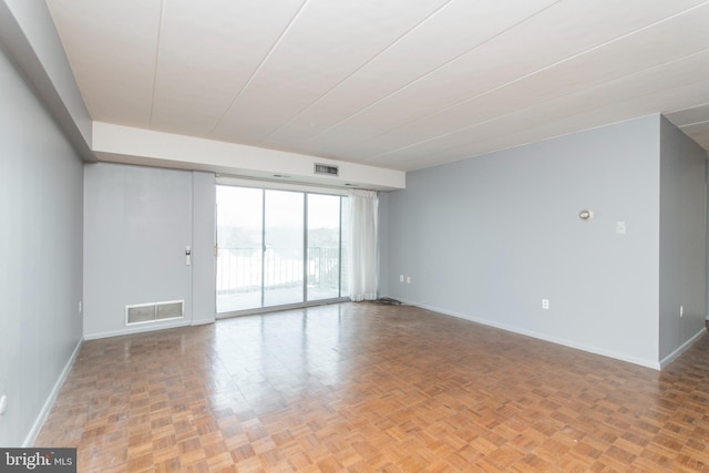 spare room with light parquet floors