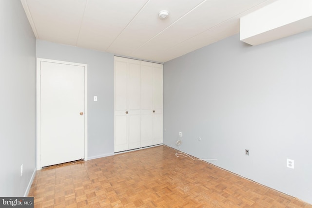 unfurnished bedroom featuring light parquet floors