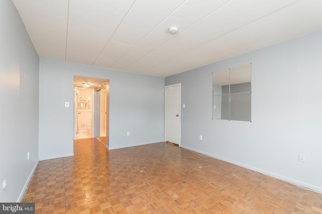 empty room with parquet flooring