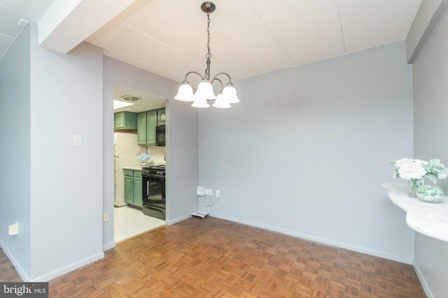 unfurnished dining area with parquet floors and an inviting chandelier