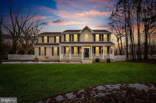 view of front of house featuring a porch and a lawn