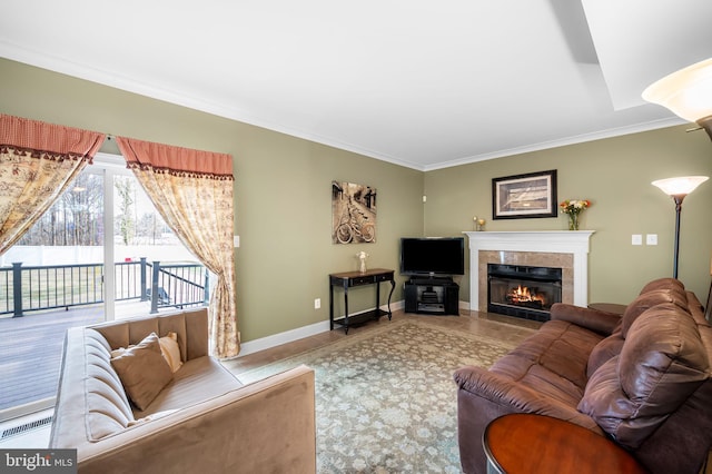 living room featuring light tile patterned floors, a fireplace, and ornamental molding