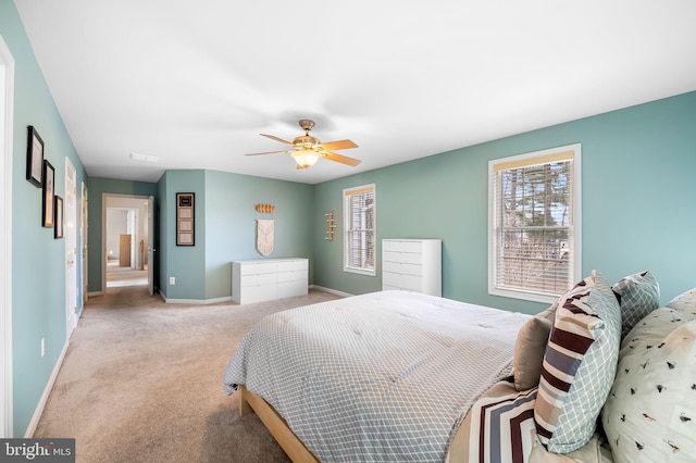 bedroom with light carpet and ceiling fan