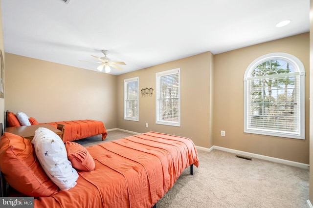 carpeted bedroom with ceiling fan