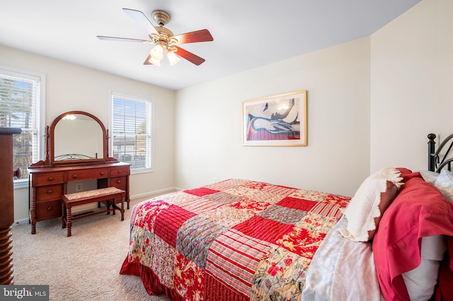 bedroom with ceiling fan and carpet flooring