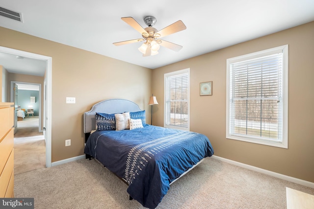 carpeted bedroom featuring ceiling fan