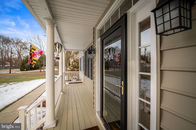 wooden terrace featuring covered porch